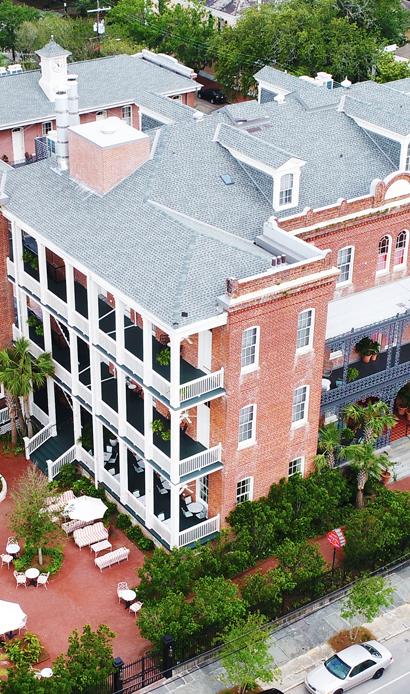 Red Tiles Building showing why choose Roofing Solutions