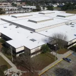 commercial roof replacement service with Roofing Solutions
