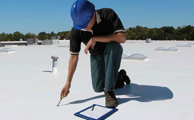 Commercial roof maintenance performed by a roofing specialist